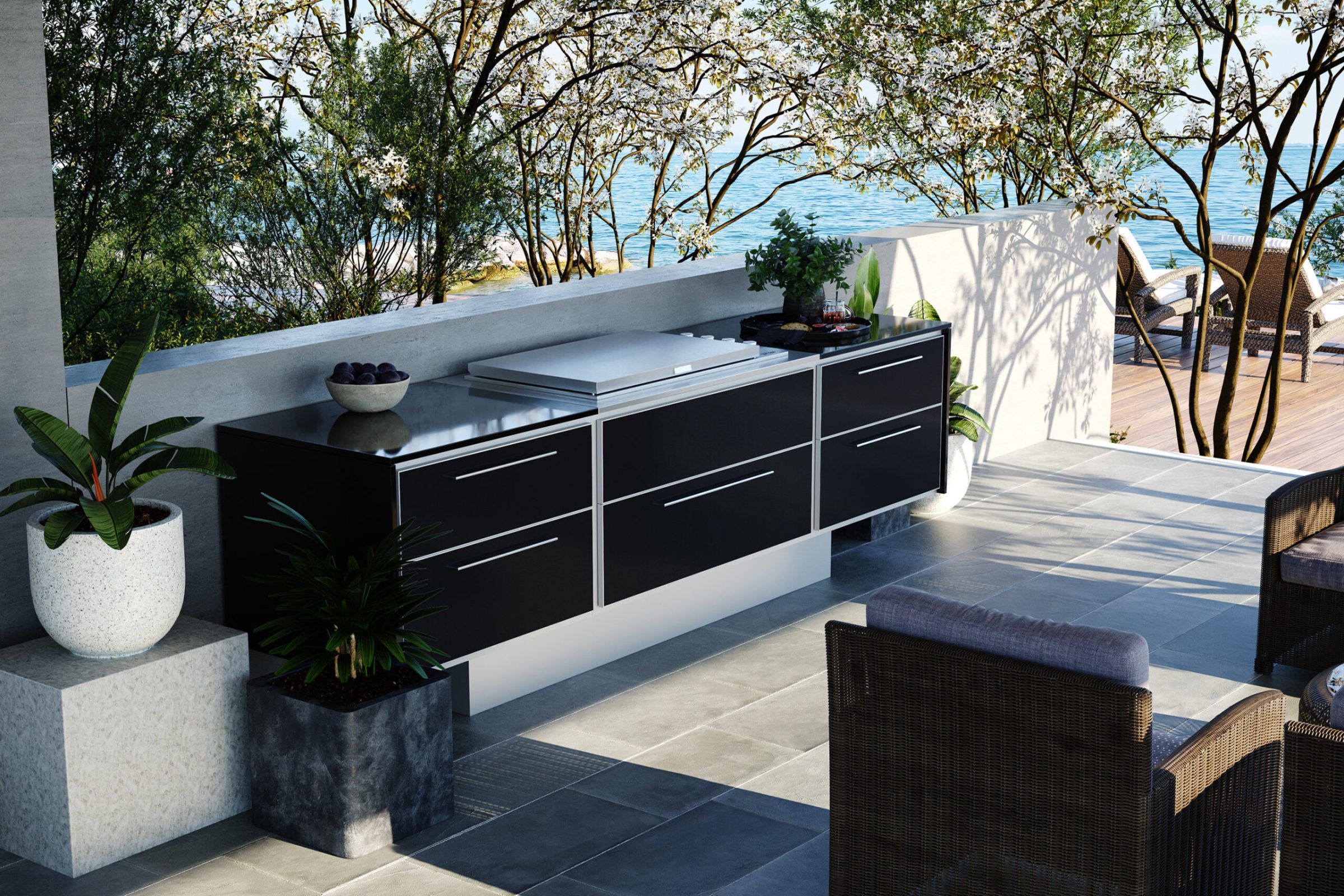 Black outdoor kitchen unit on a seafront terrace