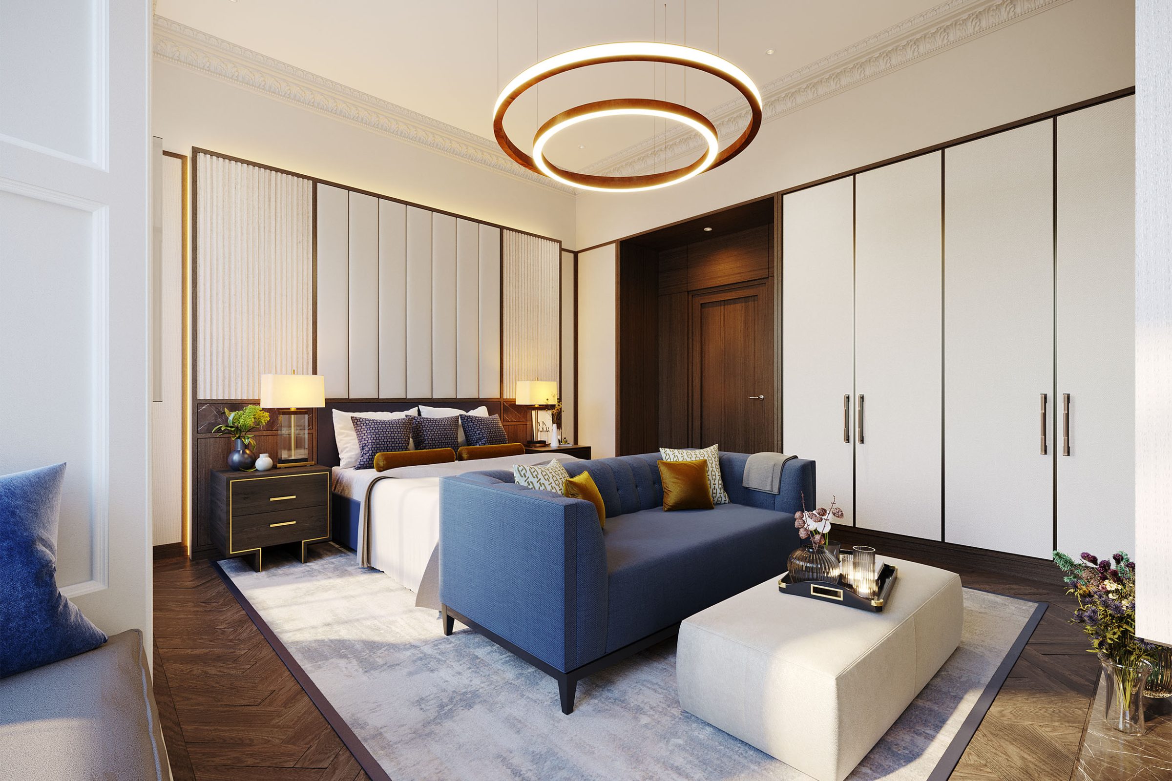 Bedroom interior with blue sofa and gold ring pendant light